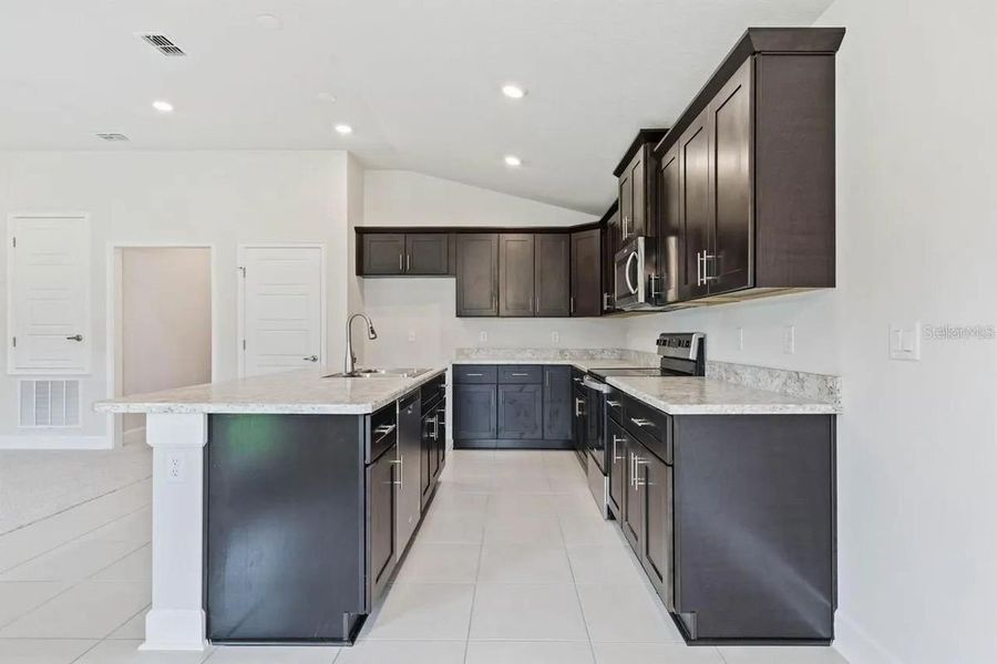 Representative furnished interior of a home built from the 1512 by Adams Homes in Winding Oaks, Weeki Wachee (Image 5).