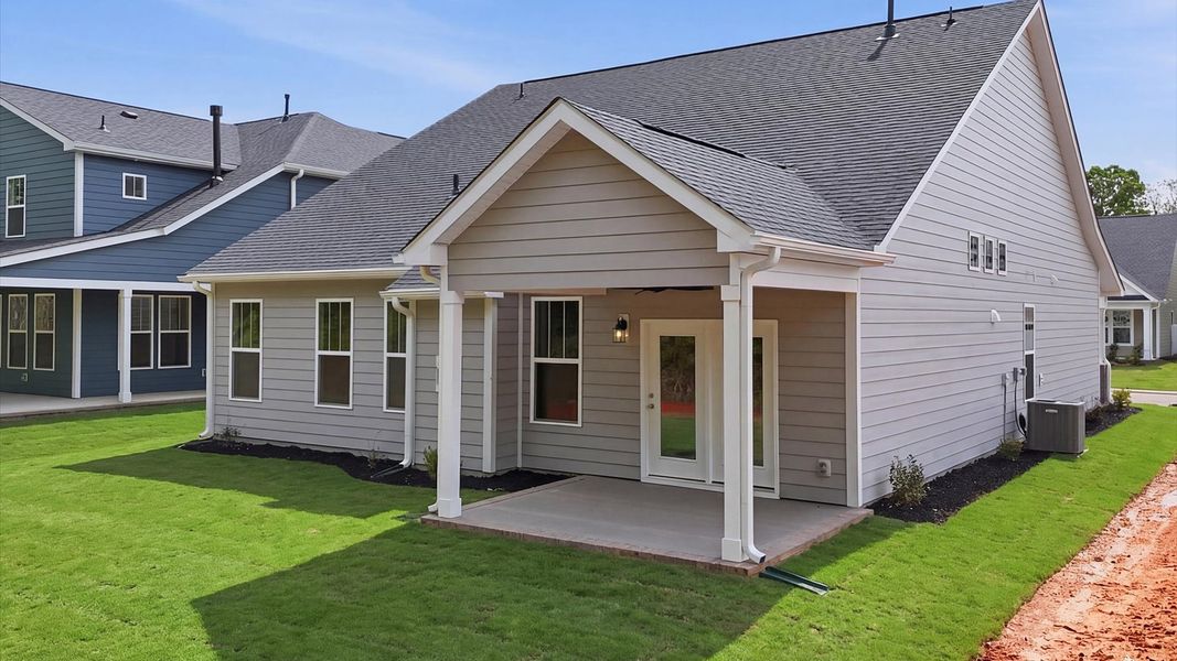 Tasteful rear porch provides a peaceful retreat and effortless indoor-outdoor flow at the Pelham Crossing community