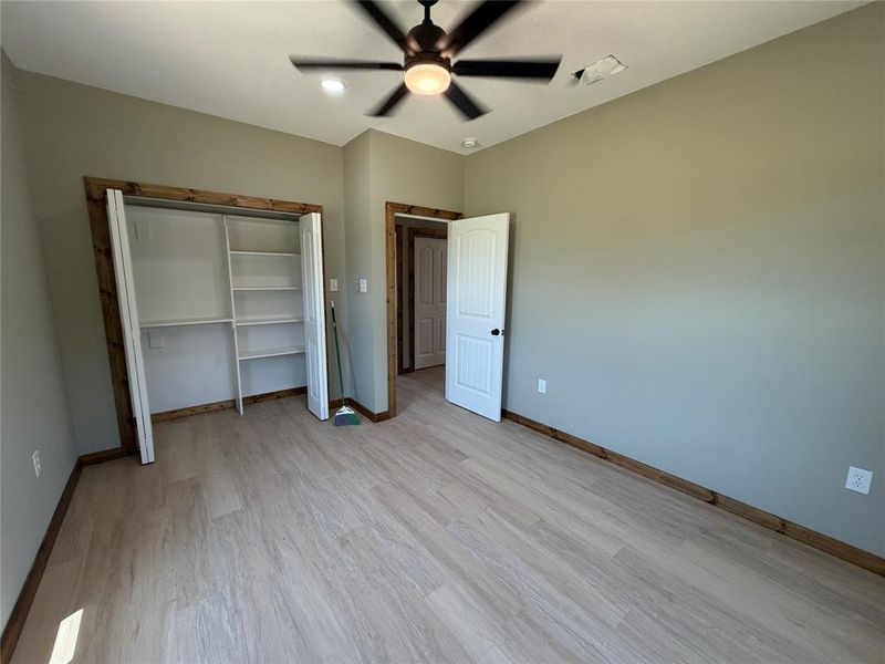 Bedroom featuring light wood-finish flooring and neutral wall tones