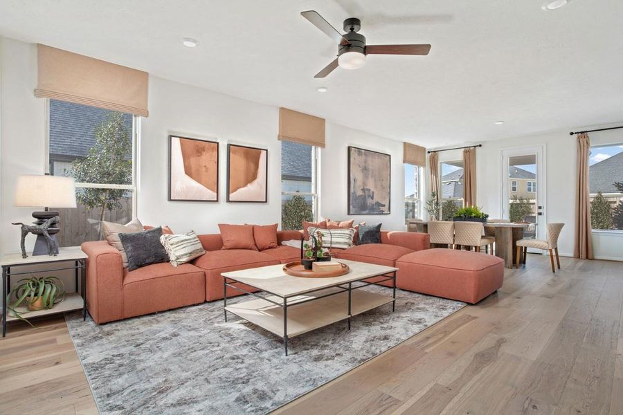 Flooded with natural light from large windows, the Great Room feels bright and airy. Recessed lighting adds to the welcoming atmosphere, perfect for gathering with family and guests. The Great Room features Engineered Wood flooring and ceiling fan!