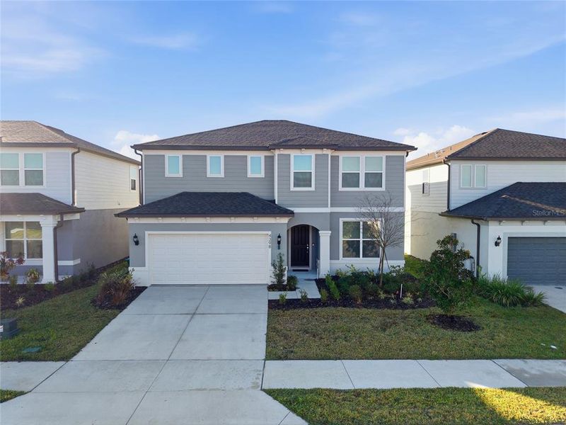 Front exterior of a new home in Marion Ranch, Ocala, FL, highlighting curb appeal (Image 30).