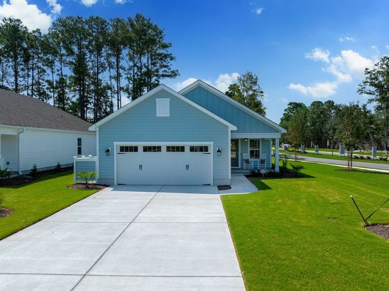 Front exterior of a new home in Osprey Landing, Southport, NC, highlighting curb appeal (Image 1).