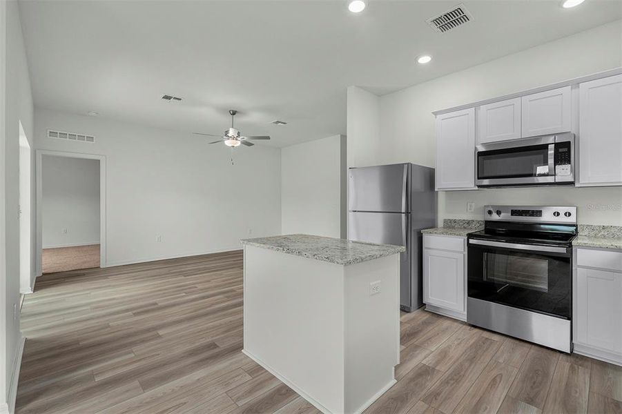 Furnished interior view inside a new home in Tula Parc, Astatula (Image 7).
