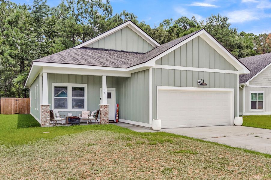 Front exterior of a new home in , Huger, SC, highlighting curb appeal (Image 1). Front exterior of a new home in , Huger, SC, highlighting curb appeal (Image 1).