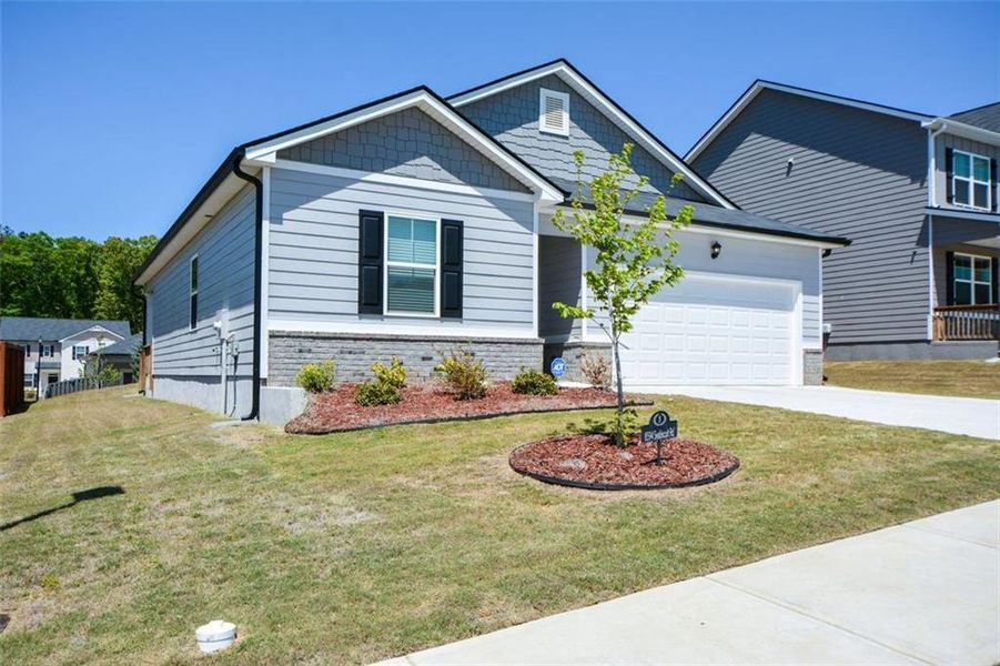 Front exterior of a new home in , Lithonia, GA, highlighting curb appeal (Image 20).