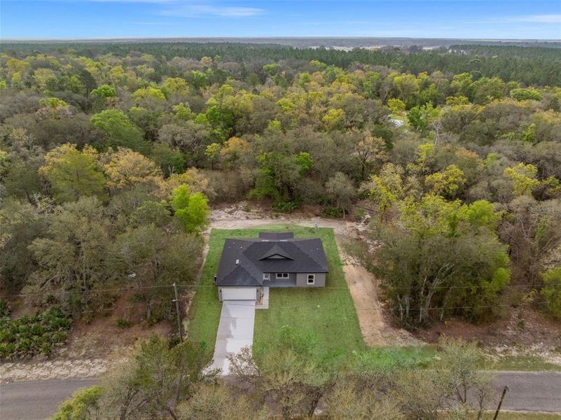 Front exterior of a new home in , Ocklawaha, FL, highlighting curb appeal (Image 22).