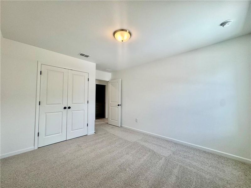 Spacious, unfurnished interior of a new home in Eastlyn Crossing, Flowery Branch (Image 17).