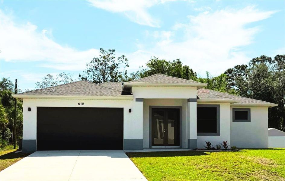 Front exterior of a new home in , Lehigh Acres, FL, highlighting curb appeal (Image 1). Front exterior of a new home in , Lehigh Acres, FL, highlighting curb appeal (Image 1).