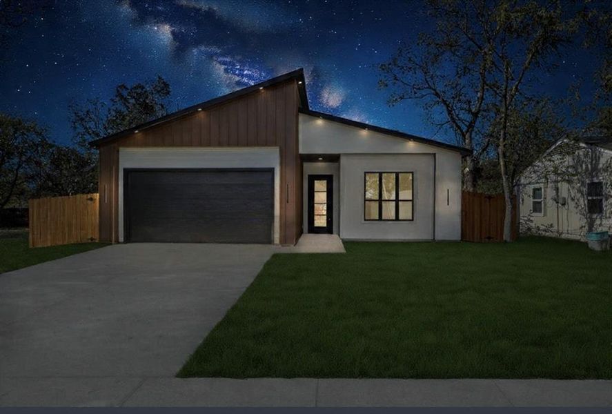 Contemporary house with driveway, a garage, and stucco siding