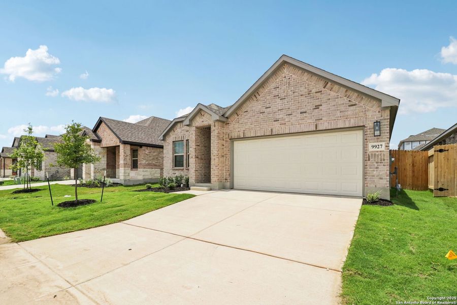 Front exterior of a new home in Kallison Ranch, San Antonio, TX, highlighting curb appeal (Image 22). Front exterior of a new home in Kallison Ranch, San Antonio, TX, highlighting curb appeal (Image 22).