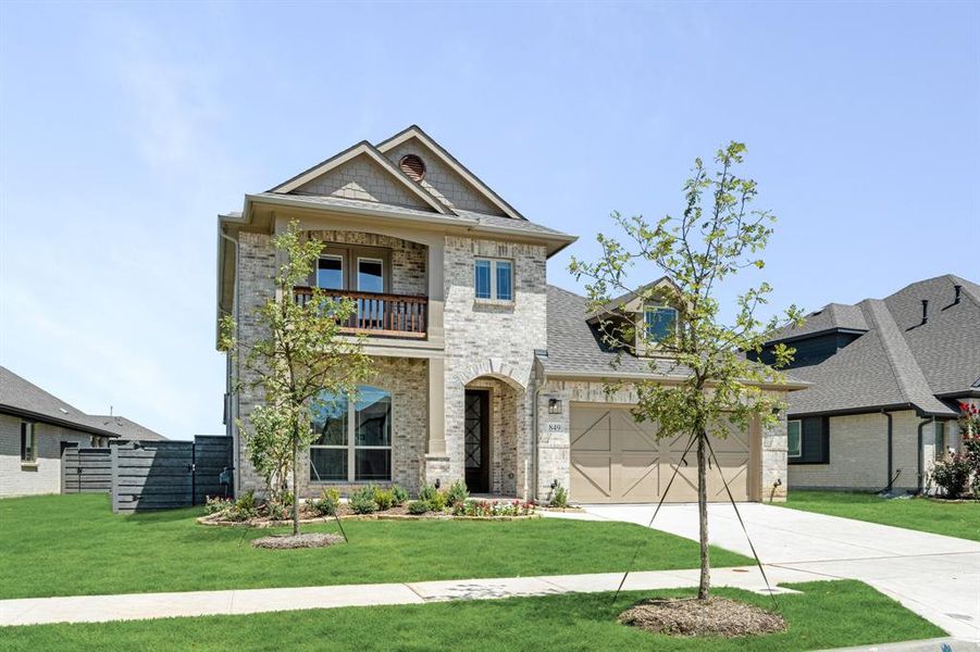 Front exterior of a new home in Union Park Classic 55, Little Elm, TX, highlighting curb appeal (Image 1).