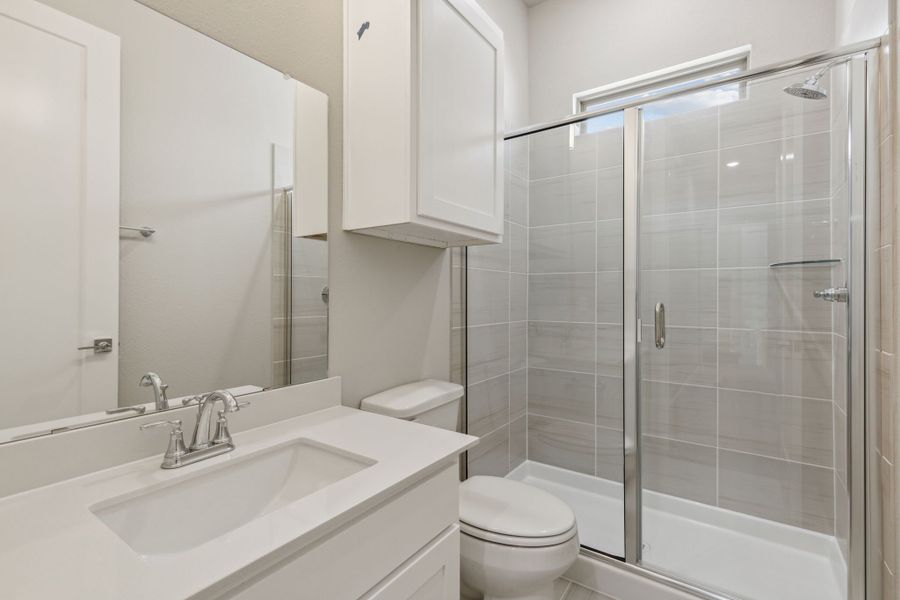 Bathroom in the Picasso II home plan by Trophy Signature Homes – REPRESENTATIVE PHOTO