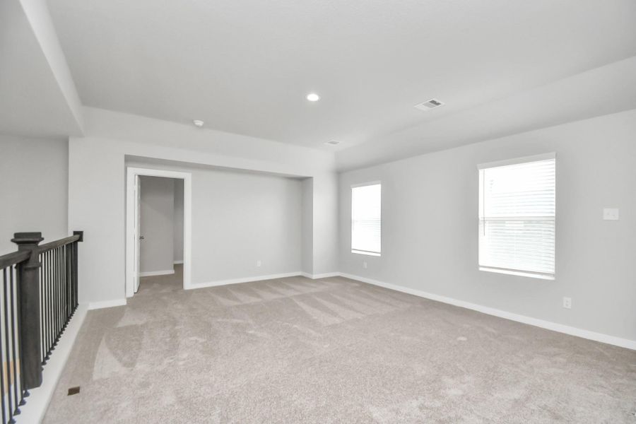 Take another look at the spacious game room! Sample photo of completed home with similar floor plan. Actual colors and selections may vary.