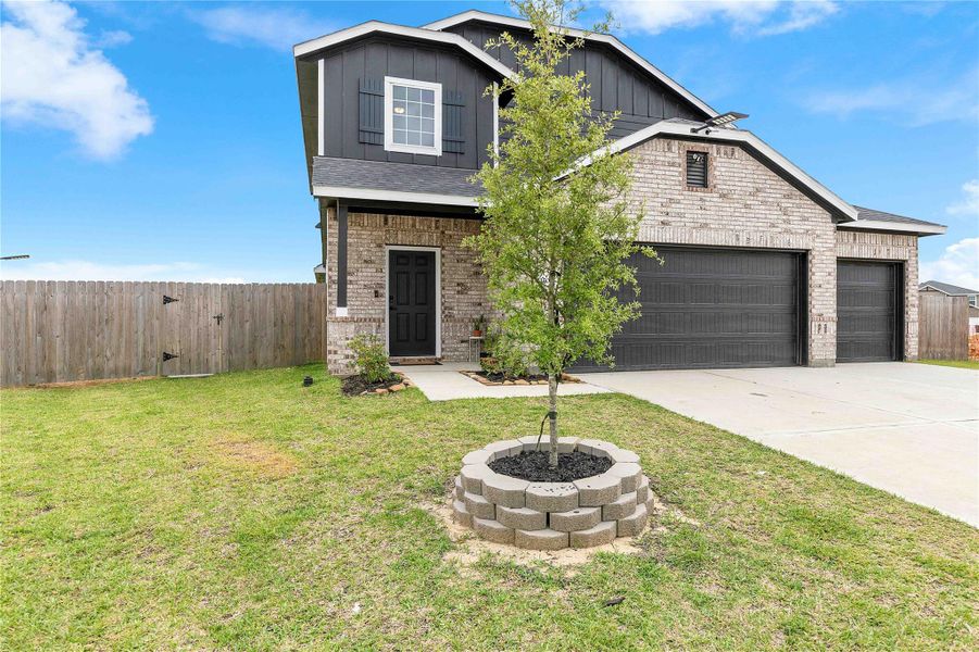 Front exterior of a new home in Sweetgrass Village, Crosby, TX, highlighting curb appeal (Image 25).