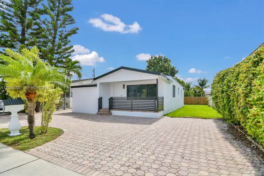 Front exterior of a new home in , Miami, FL, highlighting curb appeal (Image 1). Front exterior of a new home in , Miami, FL, highlighting curb appeal (Image 1).