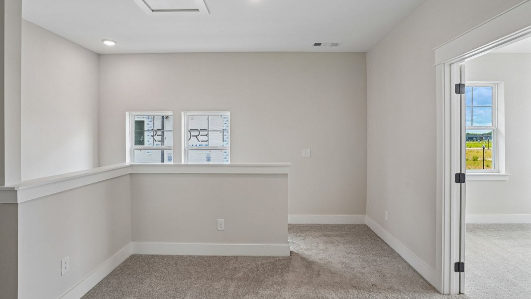 Second floor stair landing with nearby guest suite