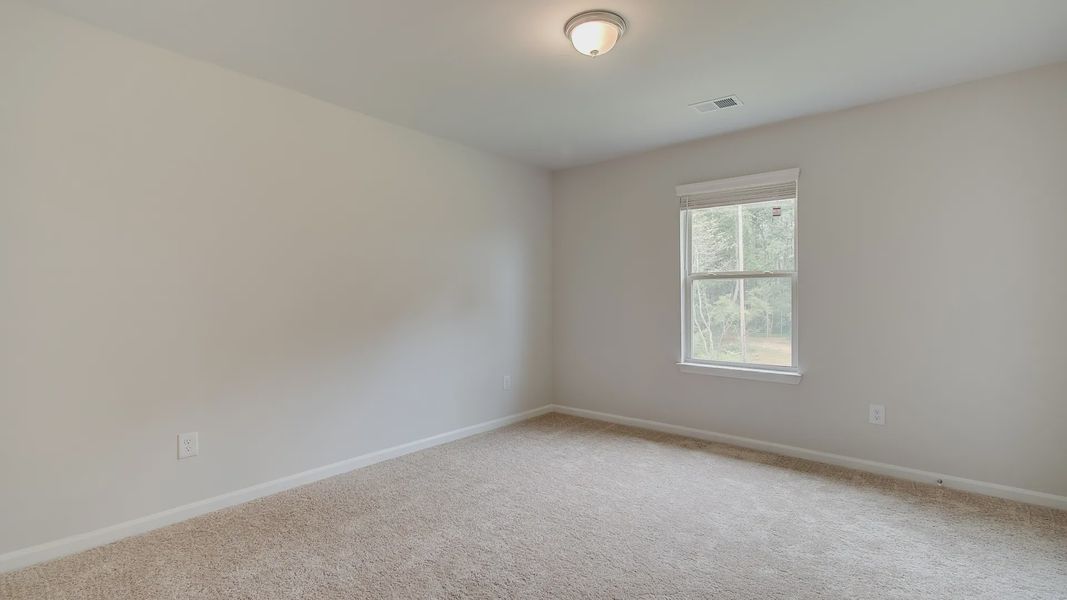 Representative furnished interior of a home built from the Meridian II by DRB Homes in Northcroft, Loganville (Image 23).