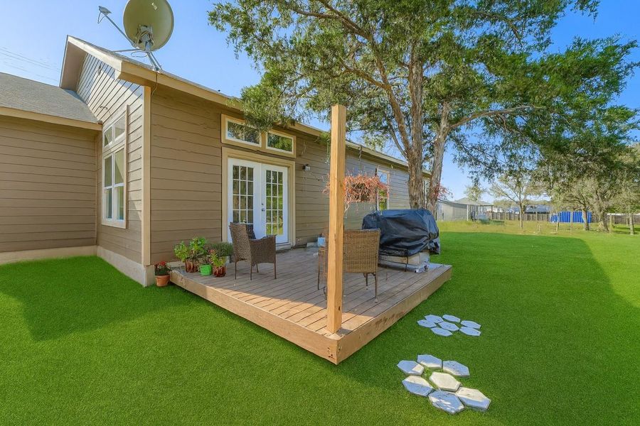 Rear view of house with french doors and a deck Rear view of house with french doors and a deck