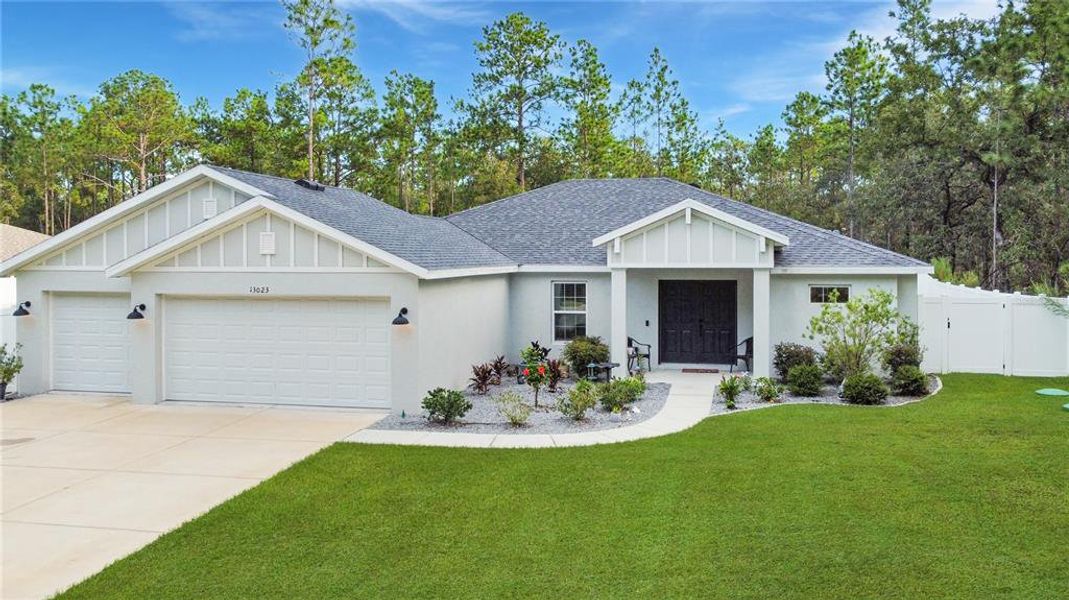 Front exterior of a new home in , Weeki Wachee, FL, highlighting curb appeal (Image 20).