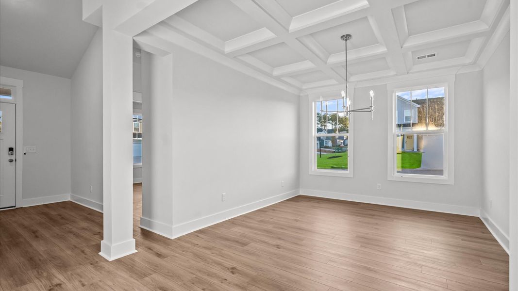 Coffered ceiling detail brings depth and sophistication to this top-notch formal dining room
