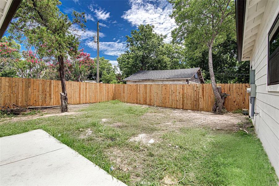 View of fenced backyard