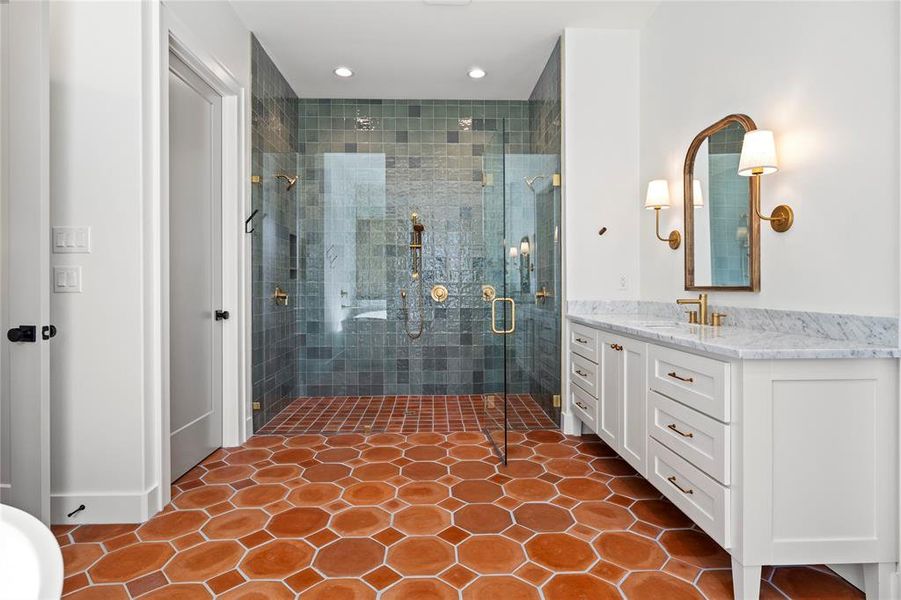 Bathroom with vanity, a stall shower, dark tile patterned flooring, and recessed lighting