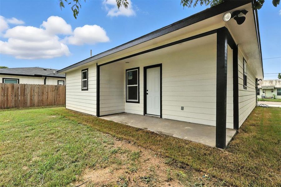 Rear view of property with a patio Rear view of property with a patio