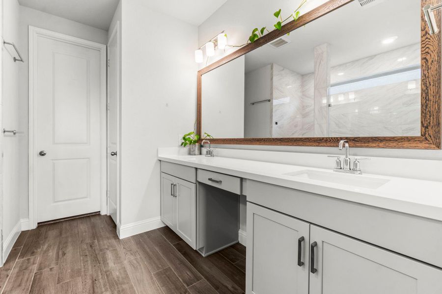 Master Bath features dual vanities and a spa-like mud set shower of your dreams!