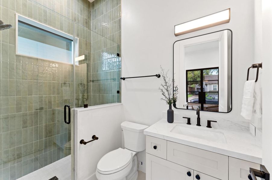 Bath for guest suite/optional study. *Previous project by the same developer, floor plans and selections may vary.*