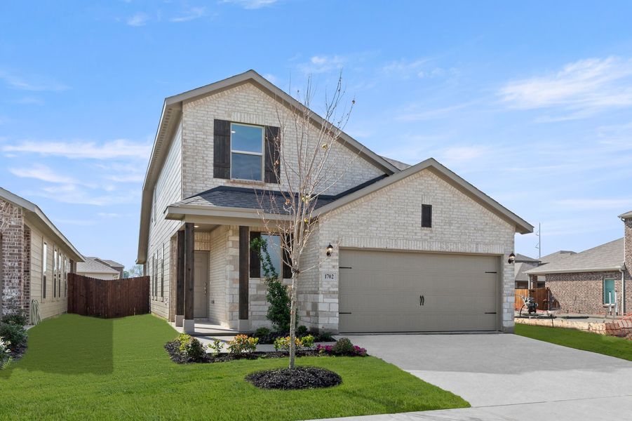 Front exterior of a new home in Creekside Ranch, Blue Ridge, TX, highlighting curb appeal (Image 2). Front exterior of a new home in Creekside Ranch, Blue Ridge, TX, highlighting curb appeal (Image 2).