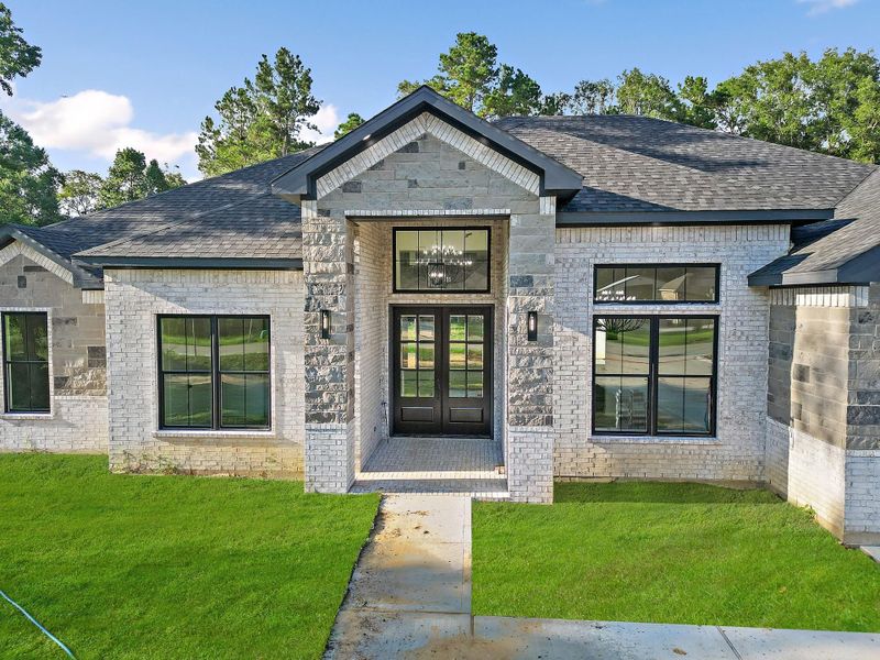 Front exterior of a new home in , Dayton, TX, highlighting curb appeal (Image 2). Front exterior of a new home in , Dayton, TX, highlighting curb appeal (Image 2).
