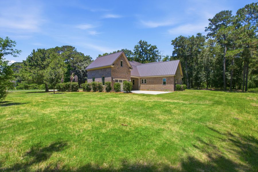 Exterior details and patio area of a home in , Johns Island (Image 33).