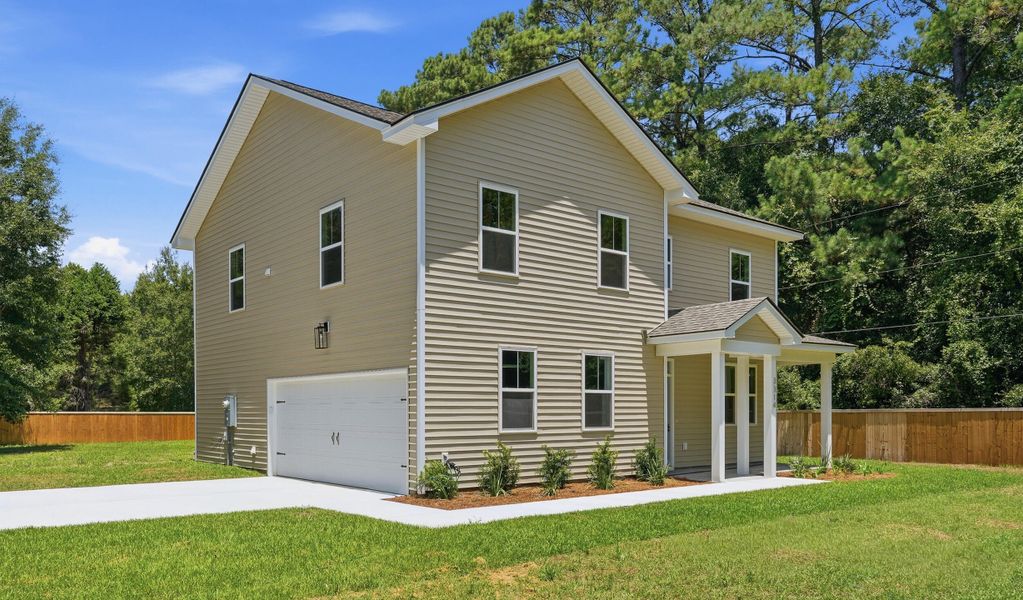 Front exterior of a new home in , Johns Island, SC, highlighting curb appeal (Image 1). Front exterior of a new home in , Johns Island, SC, highlighting curb appeal (Image 1).