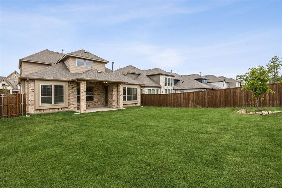 Front exterior of a new home in Lake Shore Village, Rowlett, TX, highlighting curb appeal (Image 2).