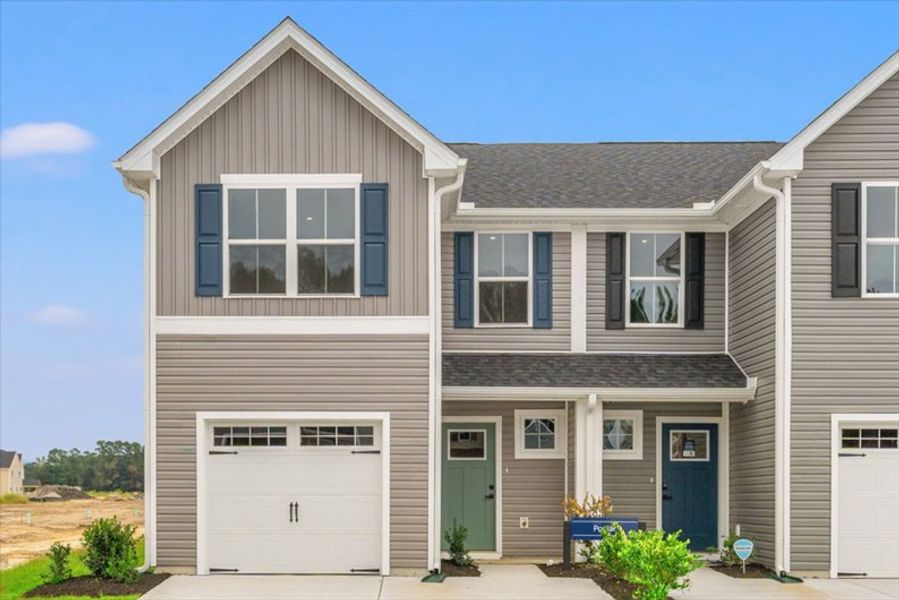 Front exterior of a home in the Bell Creek Townhomes community, located in Winnabow, NC (Image 13).