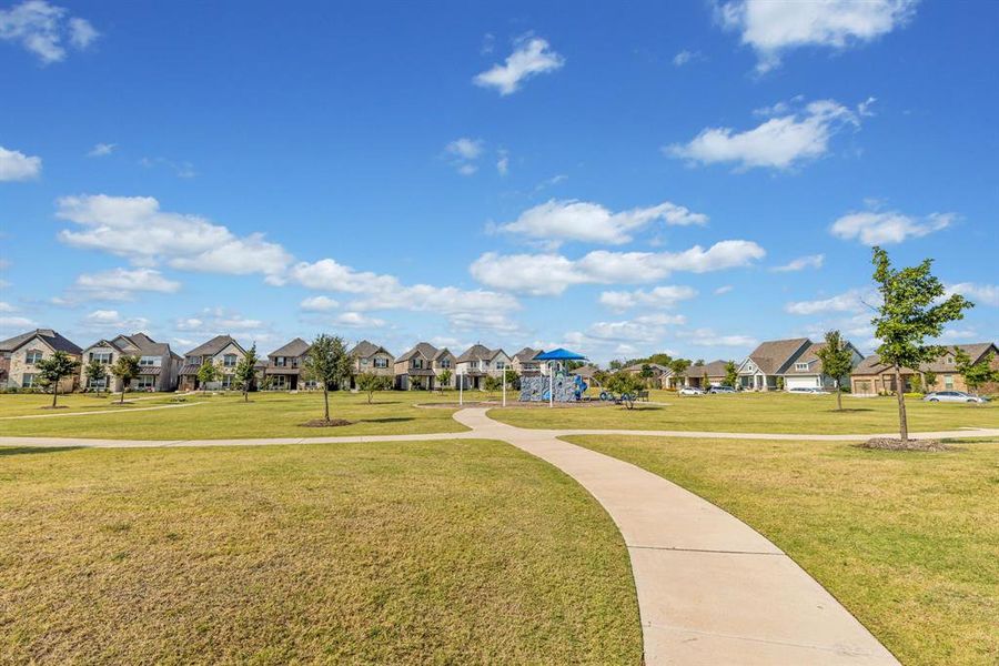 View of community with a residential view and a yard