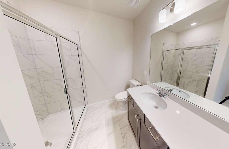 Gorgeous Owner's Suite bathroom with dual vanities, quartz countertops and walk-in shower.