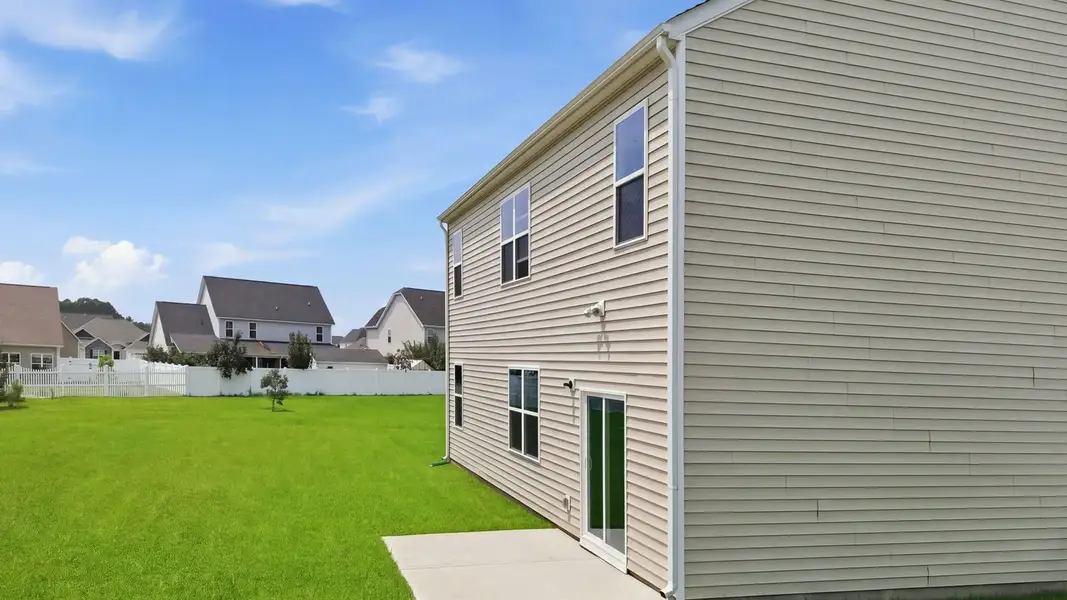 Exterior details and patio area of a home in Villa Grande, Winterville (Image 19).
