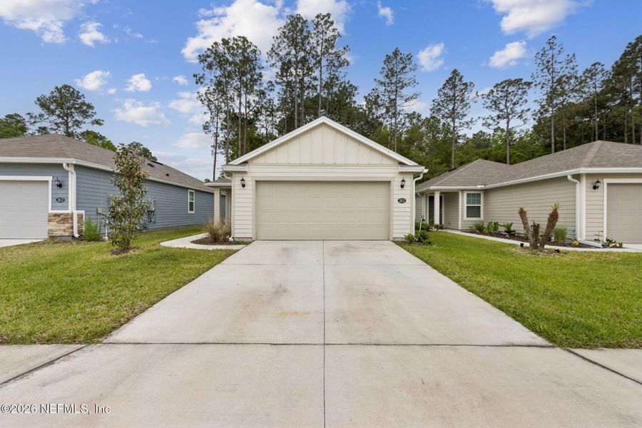 Front exterior of a new home in , Green Cove Springs, FL, highlighting curb appeal (Image 24).