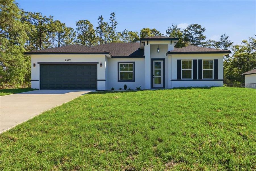 Front exterior of a new home in , Citrus Springs, FL, highlighting curb appeal (Image 21).