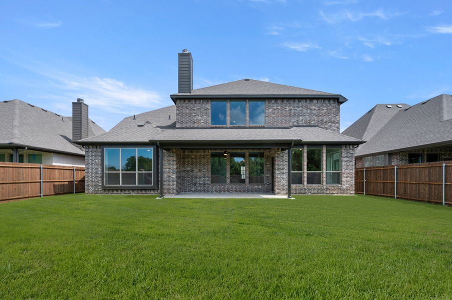 Exterior details and patio area of a home in Mockingbird Hills - Signature Series, Joshua (Image 4).