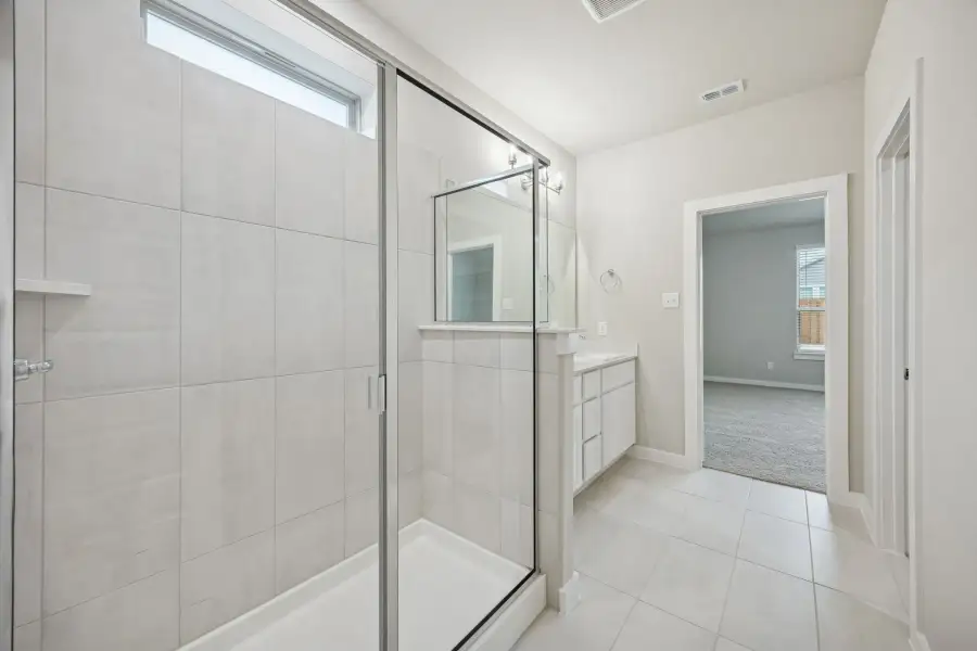 Primary Bathroom in the Stanley II home plan by Trophy Signature Homes – REPRESENTATIVE PHOTO Primary Bathroom in the Stanley II home plan by Trophy Signature Homes – REPRESENTATIVE PHOTO