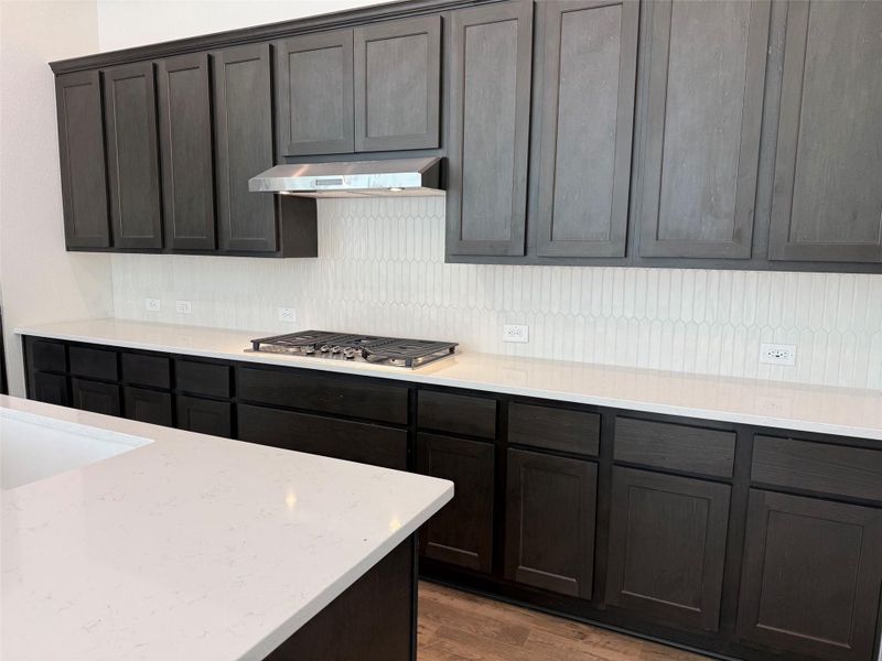 Kitchen with updated backsplash