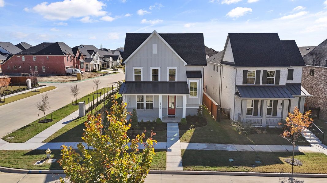 Front exterior of a new home in Fields - 40' Lots, Frisco, TX, highlighting curb appeal (Image 23). Front exterior of a new home in Fields - 40' Lots, Frisco, TX, highlighting curb appeal (Image 23).