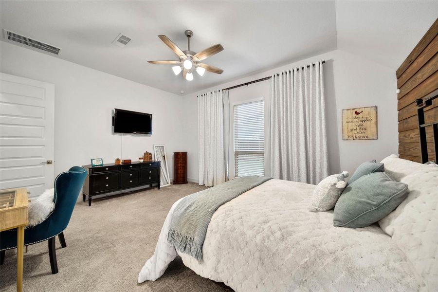 The primary suite offers plenty of room for a sitting area or large bedroom furniture, creating a comfortable retreat at the end of the day.
