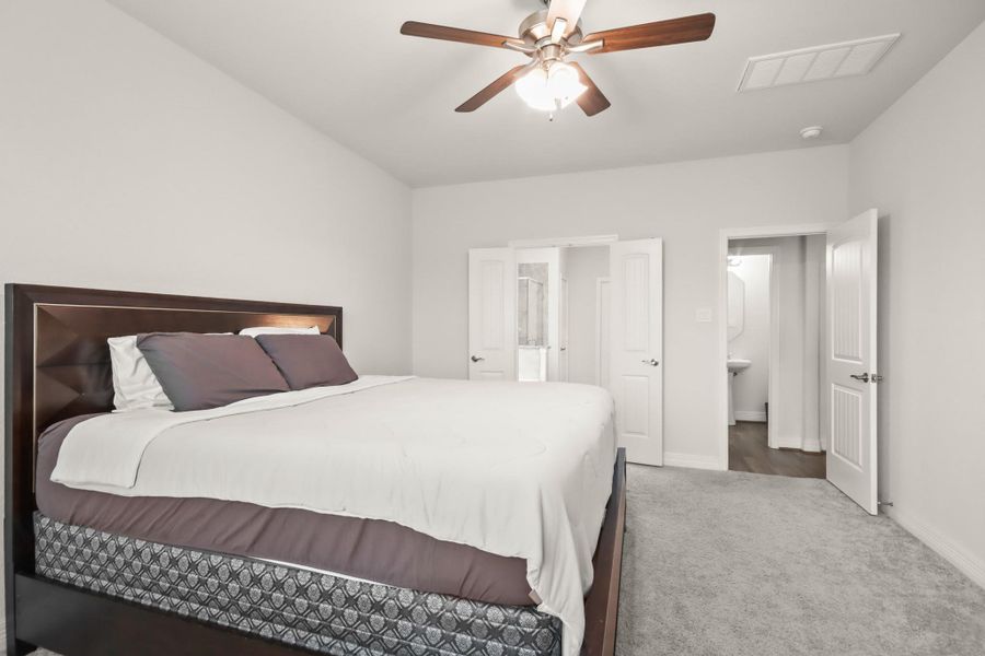 Second view of owners retreat looking into the bathroom