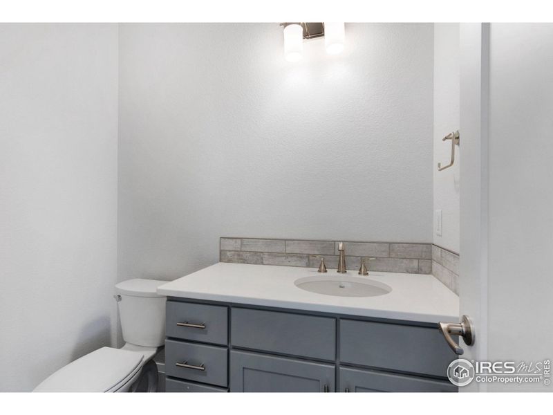 A convenient powder bath right by the front entryway and the office up front