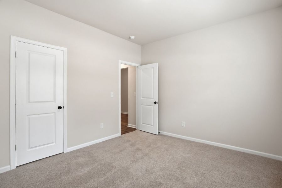 Representative unfurnished interior of a home built from the Magnolia Select M by McGuinn Homes in Broadway Lake, Anderson (Image 17).