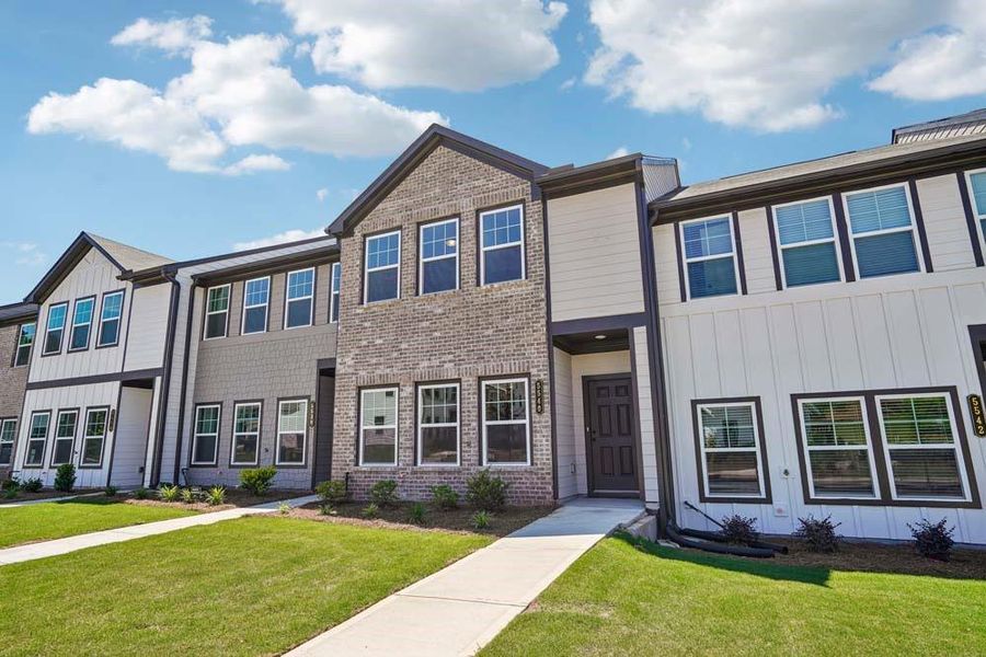 Front exterior of a new home in Laurelwood, Douglasville, GA, highlighting curb appeal (Image 17). Front exterior of a new home in Laurelwood, Douglasville, GA, highlighting curb appeal (Image 17).