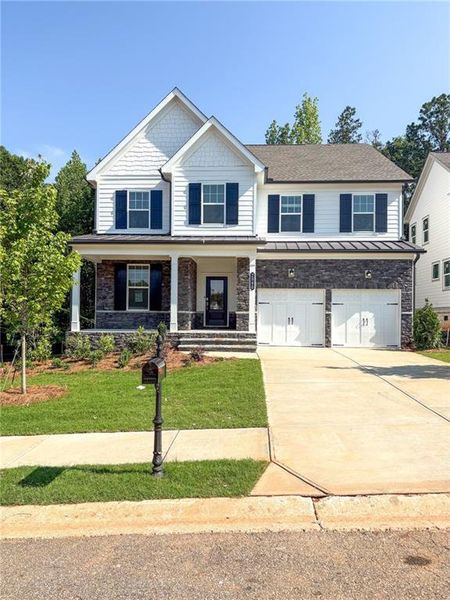 Front exterior of a new home in , Watkinsville, GA, highlighting curb appeal (Image 1). Front exterior of a new home in , Watkinsville, GA, highlighting curb appeal (Image 1).